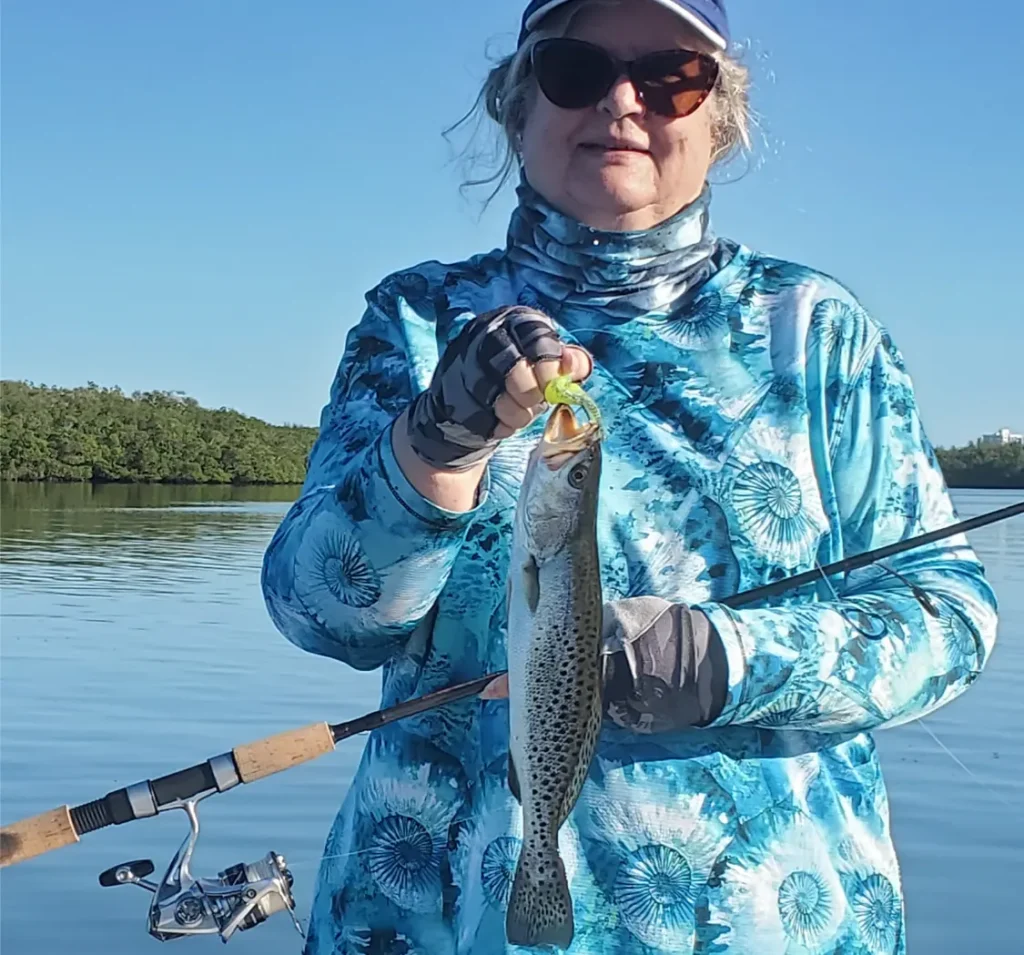 Kim shows-off the first of several trout we caught near a mangrove shoreline!